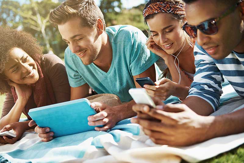 Friends laying down at the park